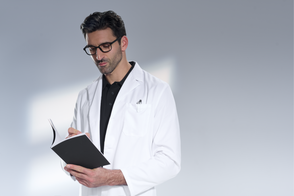 Doctor staring at a black notebook